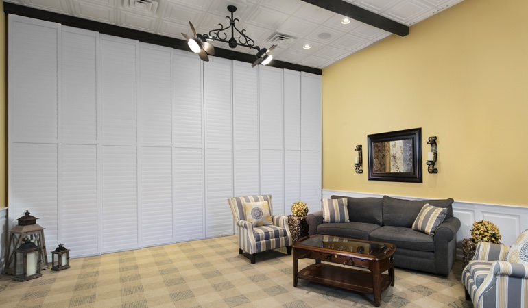 Interior shutters as a room divider for a showroom